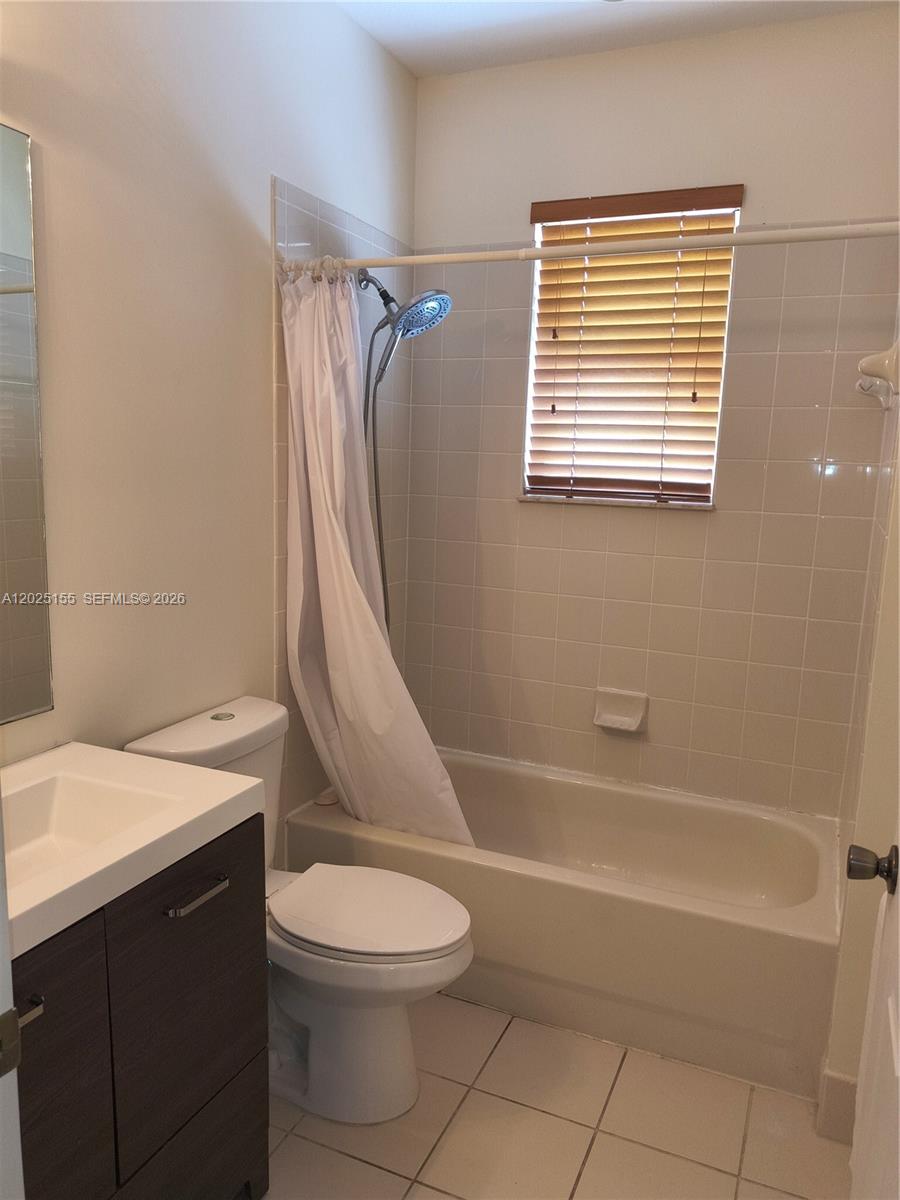 1645 Southeast 20th Road, Unit 1645 Homestead, FL 33035 - Photo 13 of 20 a bathroom with a sink a toilet and shower