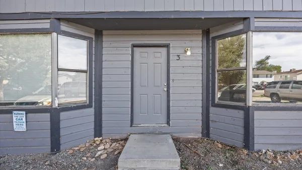a view of a door and a window