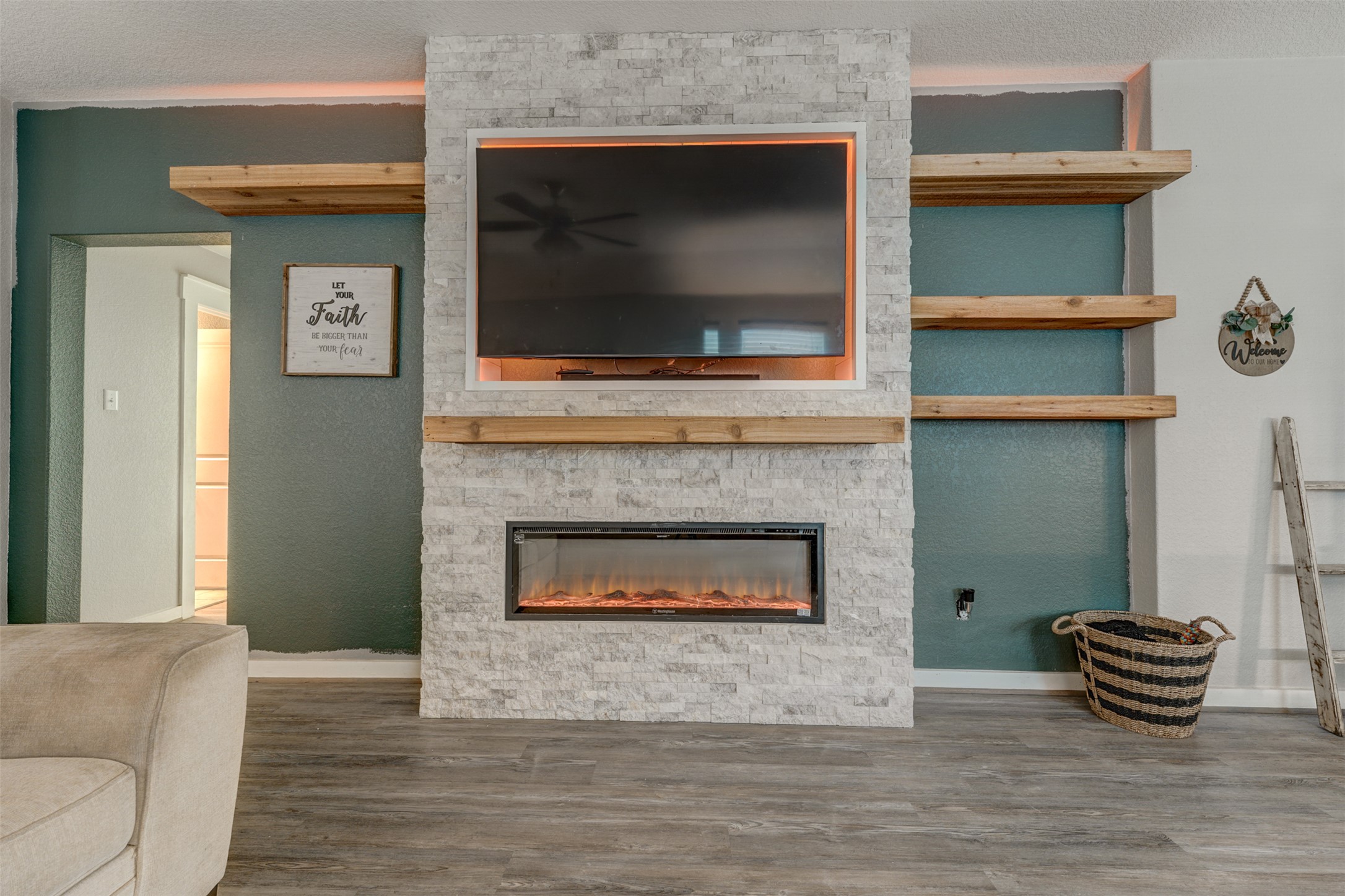 5806 Aviano Road Round Rock, TX 78665 - Photo 13 of 29 A striking stone fireplace with an integrated media center anchors this inviting living space.
