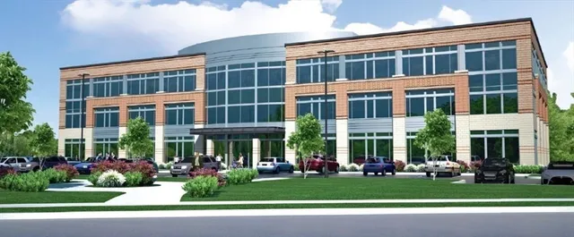 a front view of a building with garden