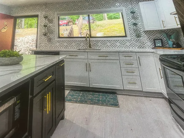 a dining room with furniture and a window