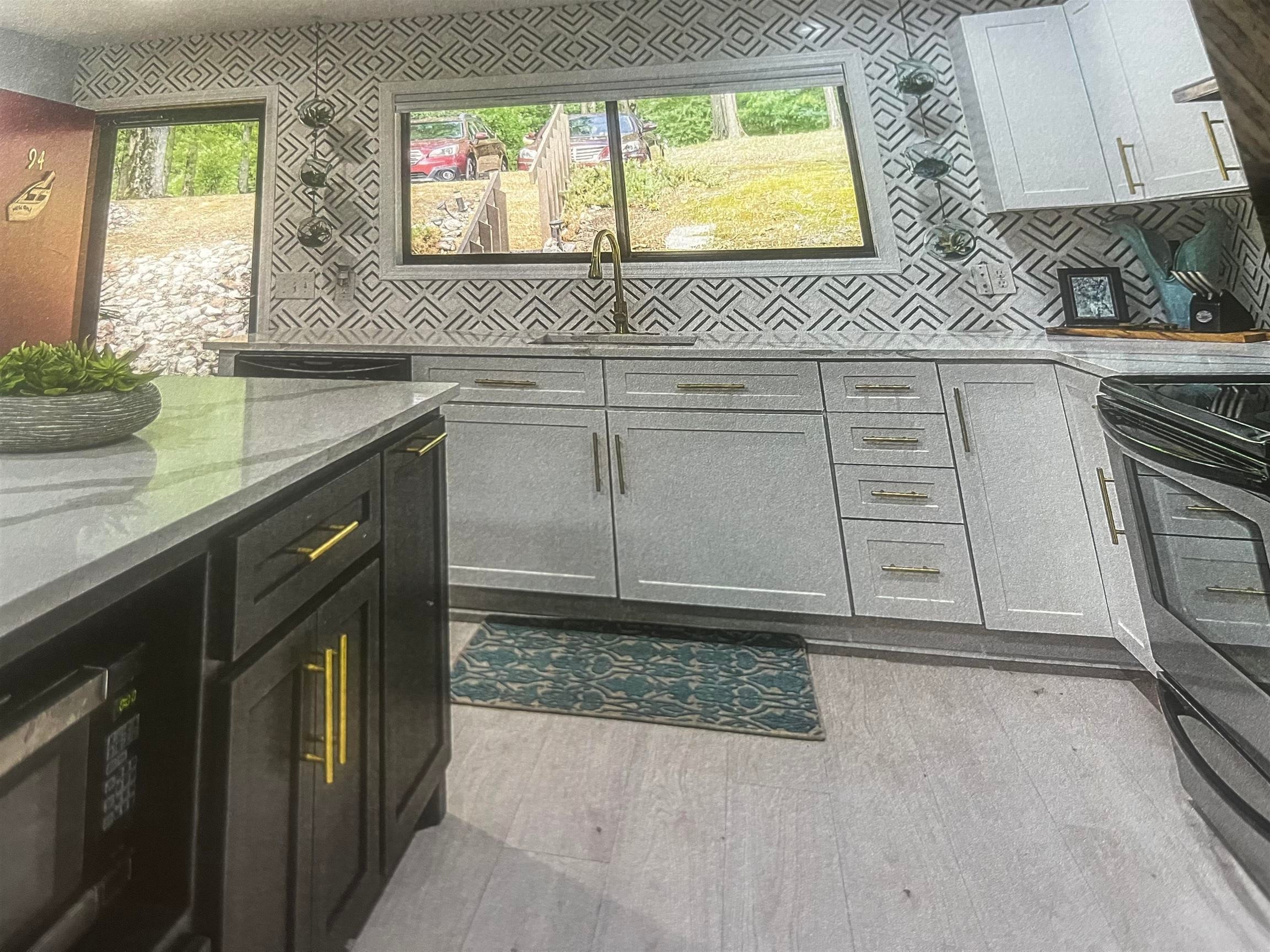 98 Driftwood Road, Unit 94 Counce, TN 38326 - Photo 5 of 18 Bathroom view of a tile shower and ventilation hood