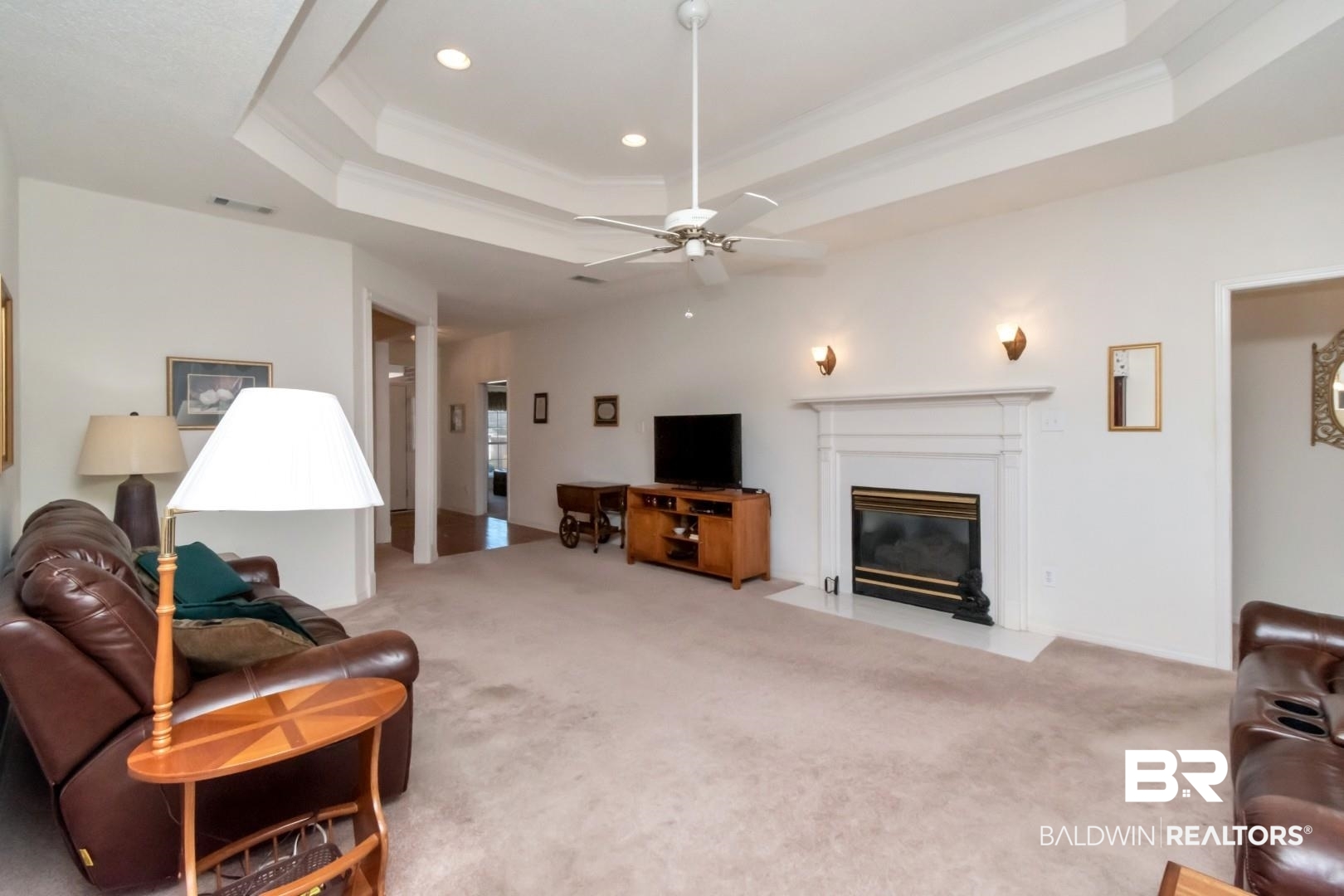 1032 Cross Gates Place Mobile, AL 36609 - Photo 19 of 34 Living room featuring ceiling fan, carpet flooring, a fireplace with flush hearth, ornamental molding, and recessed lighting