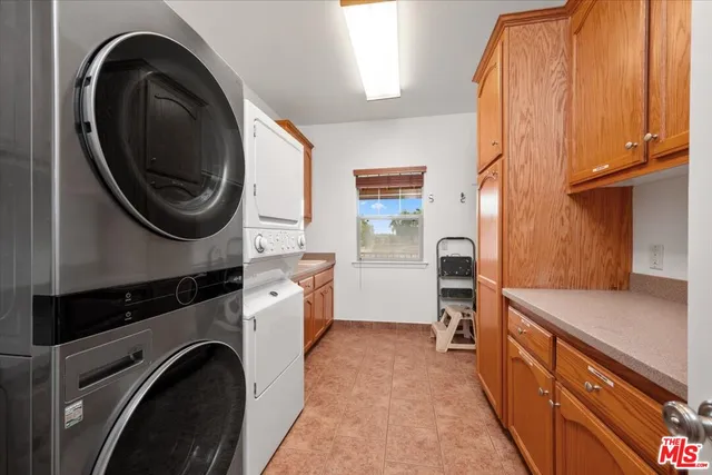 a bathroom with a sink vanity granite toilet and shower