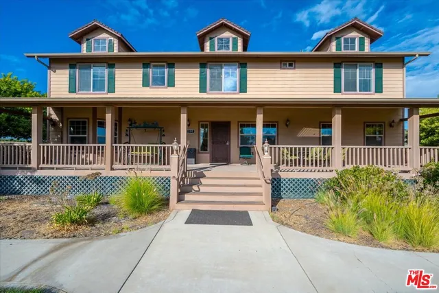a view of balcony with wooden floor