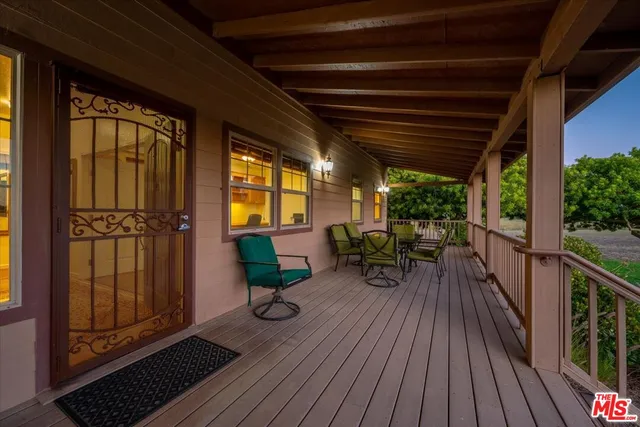 a view of a chair and table in the balcony