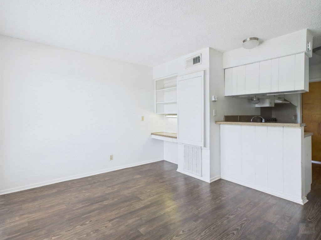2808 Whitis Avenue, Unit C303 Austin, TX 78705 - Photo 1 of 21 a kitchen with granite countertop a sink and a stove top oven