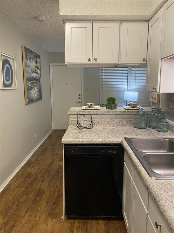 2808 Whitis Avenue, Unit C303 Austin, TX 78705 - Photo 17 of 21 a kitchen with granite countertop a sink stove and cabinets