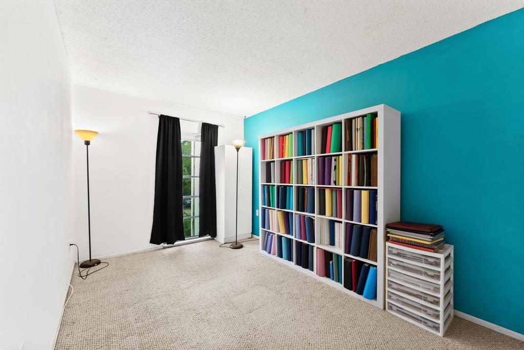 3320 Simms Street, Unit 11C Hollywood, FL 33021 - Photo 19 of 37 a bedroom with a book shelf