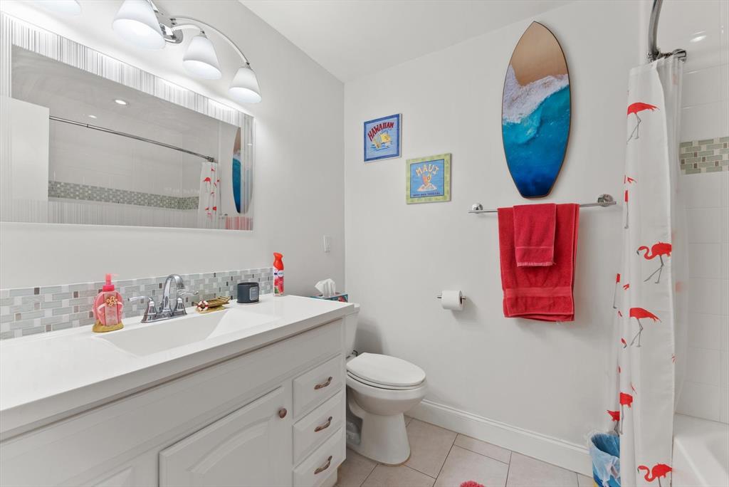 3320 Simms Street, Unit 11C Hollywood, FL 33021 - Photo 21 of 37 a bathroom with a sink mirror and vanity