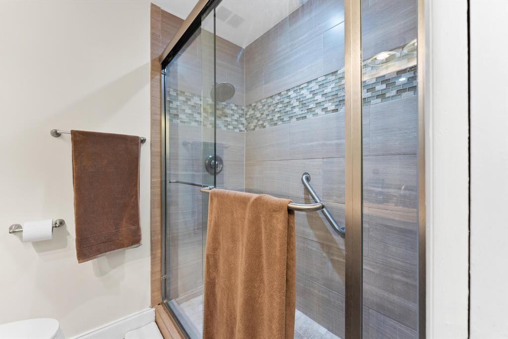 3320 Simms Street, Unit 11C Hollywood, FL 33021 - Photo 27 of 37 a bathroom with a shower and a glass door