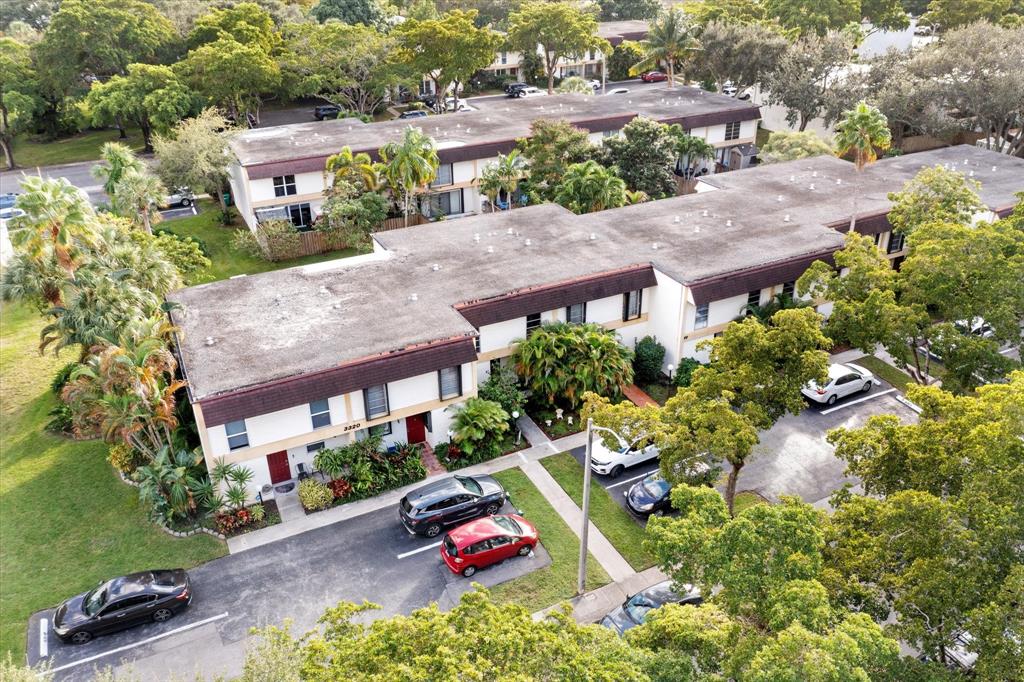 3320 Simms Street, Unit 11C Hollywood, FL 33021 - Photo 30 of 37 an aerial view of multiple houses with yard