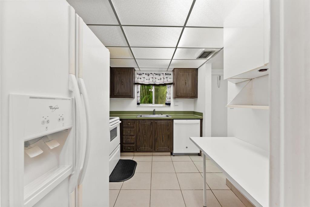 3320 Simms Street, Unit 11C Hollywood, FL 33021 - Photo 7 of 37 a bathroom with a sink a vanity and a mirror