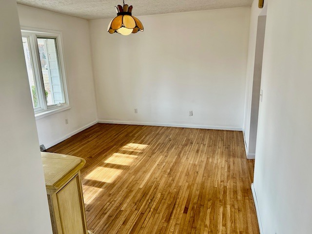 1515 6 Points Road Bloomington, IL 61701 - Photo 11 of 29 a view of a room with wooden floor and window