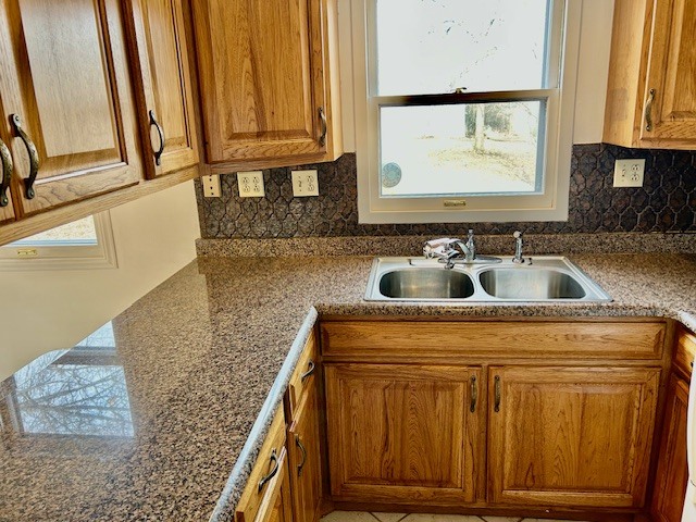 1515 6 Points Road Bloomington, IL 61701 - Photo 15 of 29 a kitchen with granite countertop a sink and cabinets