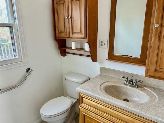 1515 6 Points Road Bloomington, IL 61701 - Photo 16 of 29 a bathroom with a granite countertop sink and a mirror