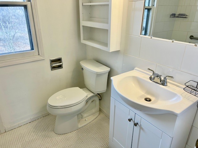 1515 6 Points Road Bloomington, IL 61701 - Photo 22 of 29 a bathroom with a sink and a toilet