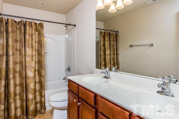 317 Euphoria Circle Cary, NC 27519 - Photo 16 of 22 a bathroom with a sink and a mirror