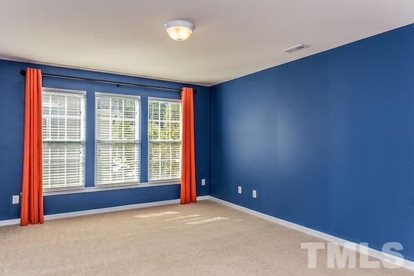 317 Euphoria Circle Cary, NC 27519 - Photo 19 of 22 an empty room with windows