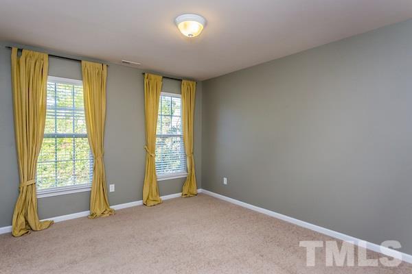 317 Euphoria Circle Cary, NC 27519 - Photo 20 of 22 a view of an empty room with a window