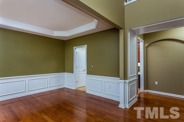 317 Euphoria Circle Cary, NC 27519 - Photo 2 of 22 an empty room with wooden floor and windows