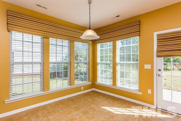 317 Euphoria Circle Cary, NC 27519 - Photo 6 of 22 a view of an empty room with a window