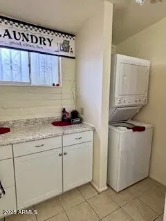 a room with a sink and cabinets