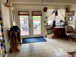 a view of a entryway with furniture and floor to ceiling window