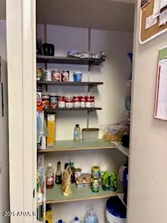 a shelf with cup and plates