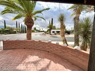 a building outdoor space with patio furniture and a potted plant