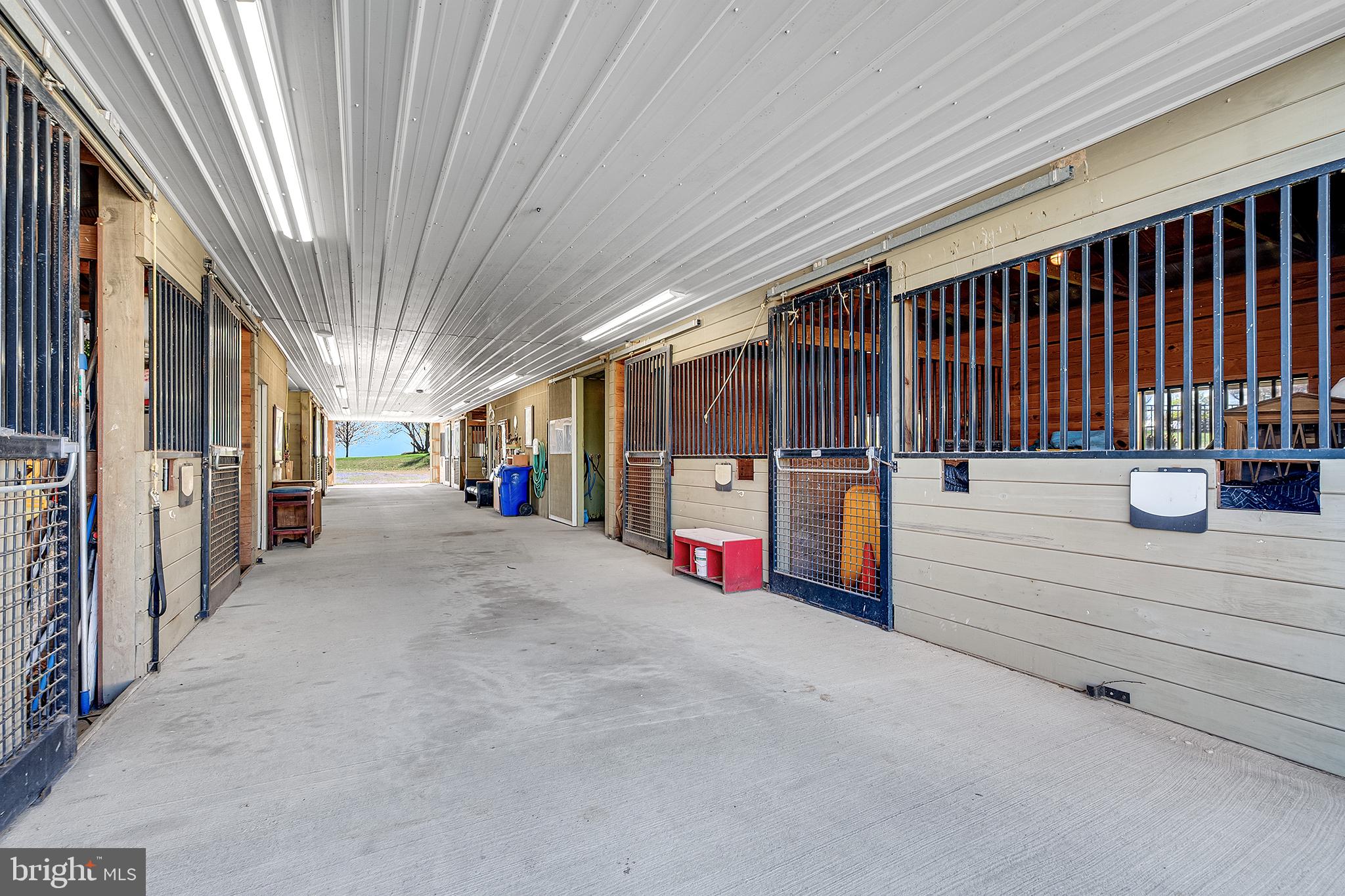 26100 Mullinix Mill Road Mount Airy, MD 21771 - Photo 85 of 99 Spacious equestrian barn corridor.
