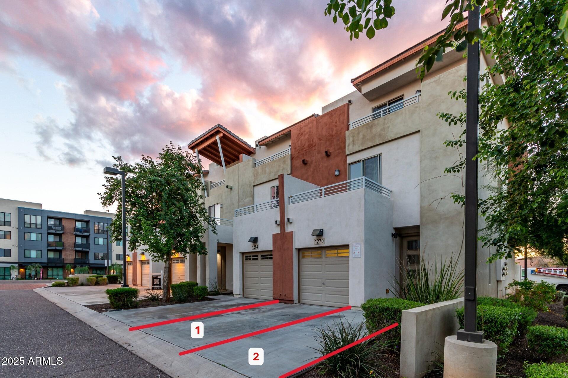 a front view of a building with garden