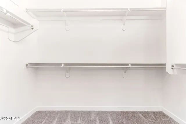 a picture of a bench in front of a wall