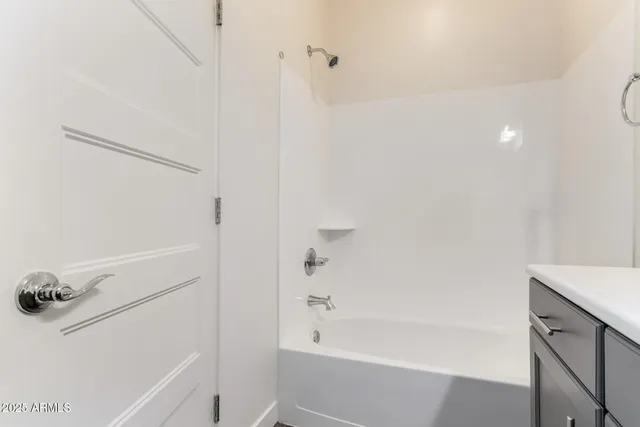 a picture of a room with a white wall and a large window