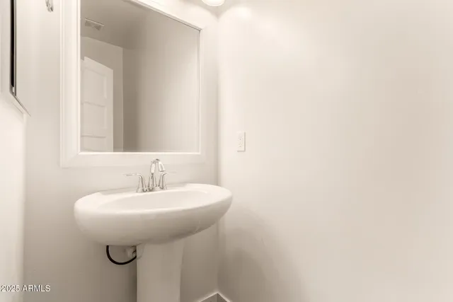 a bedroom with a large bed and a couch