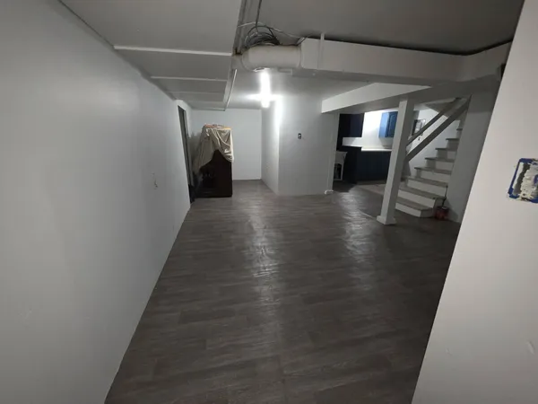 a view of gallery with wooden floor