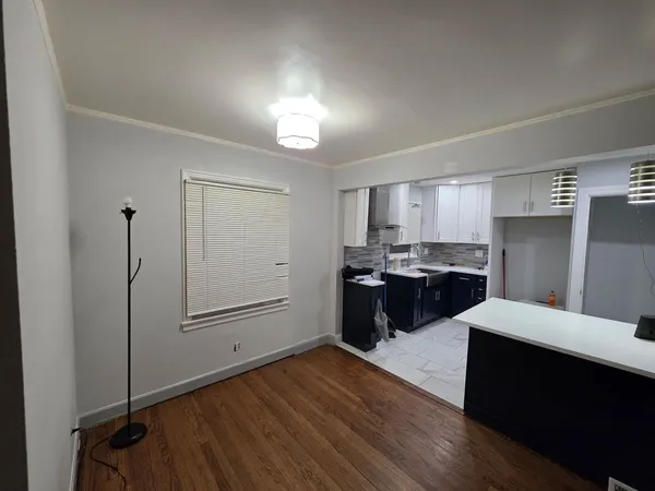 a kitchen with a refrigerator and a sink