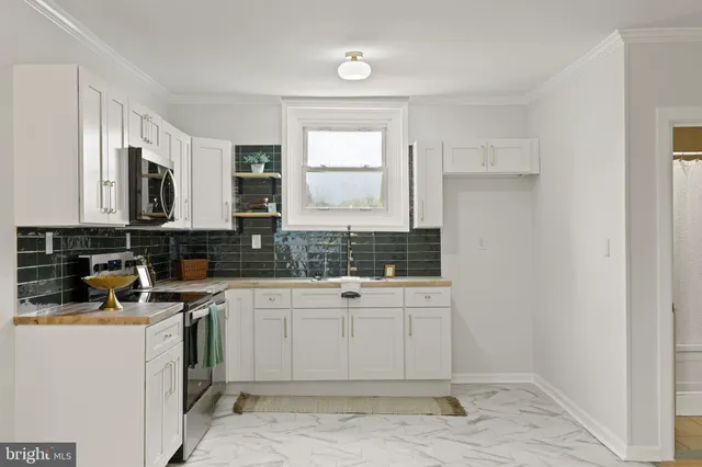 a view of a kitchen with a sink