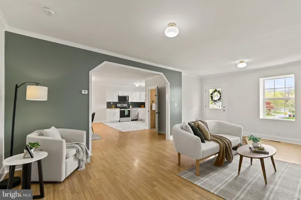 a living room with furniture and a table