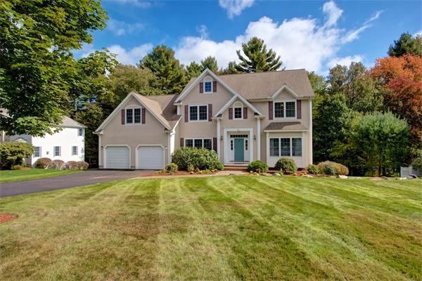 24 Battle Flagg Road Bedford, MA 01730 - Photo 1 of 30 a front view of a house with yard and green space