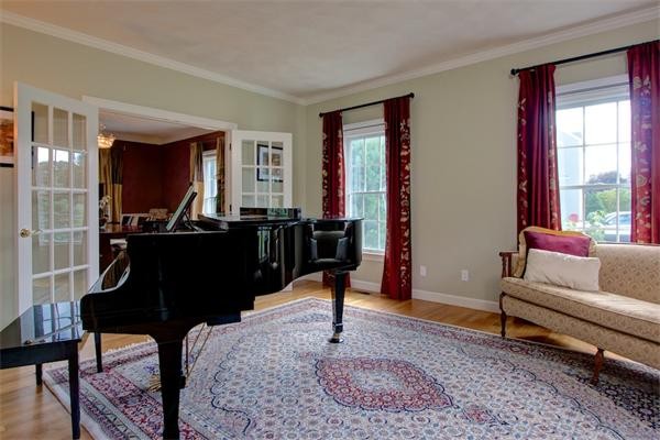 24 Battle Flagg Road Bedford, MA 01730 - Photo 8 of 30 a living room with furniture a window and a table
