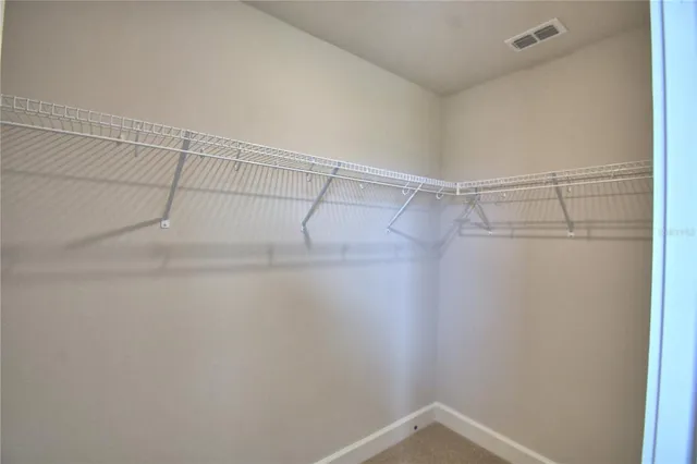 an empty room with closet area