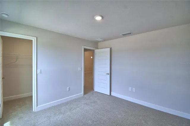 a kitchen with kitchen island a sink stainless steel appliances and cabinets