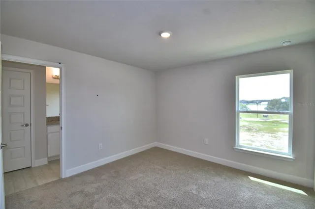 an empty room with closet area