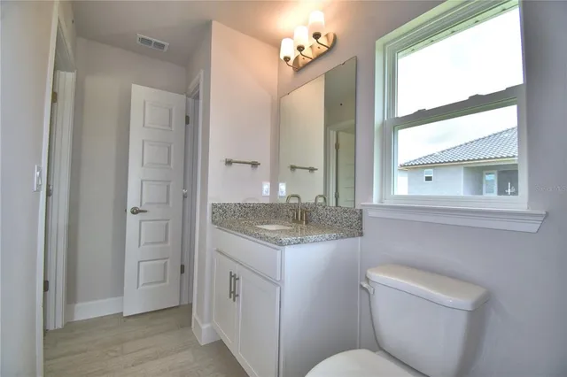 a bathroom with a bathtub and window