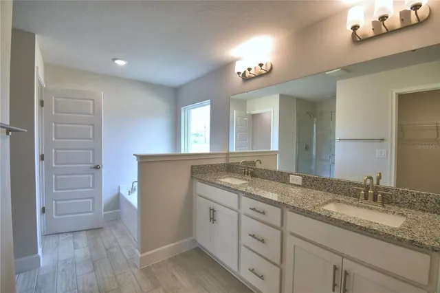 a bathroom with a shower and toilet