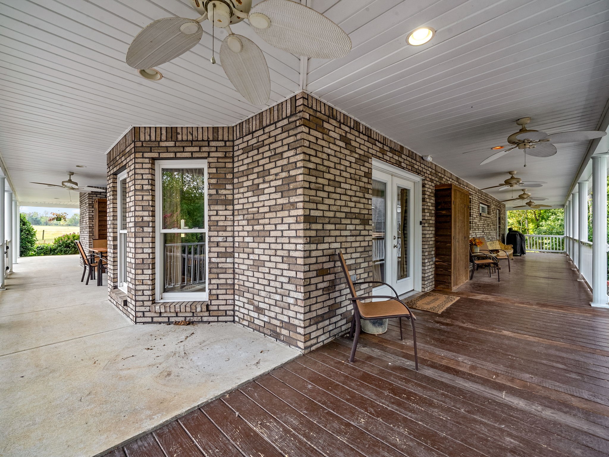 2834 Mosley Ferry Road Ashland City, TN 37015 - Photo 69 of 89 a view of a patio with table and chairs with wooden floor and fence