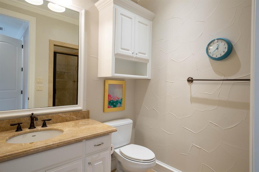 2101 Vail Road Southlake, TX 76092 - Photo 29 of 40 a bathroom with a granite countertop toilet sink and mirror