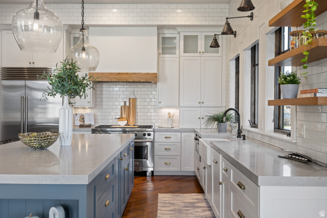 707 Chimney Rock Road, Unit 247 Heber City, UT 84032 - Photo 9 of 64 Kitchen featuring white cabinets, light stone counters, pendant lighting, open shelves, and high quality appliances