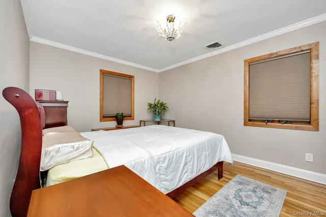 a bedroom with bed and a desk